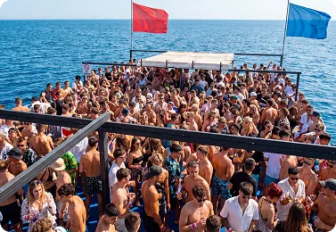 The packed party boat seen from the water